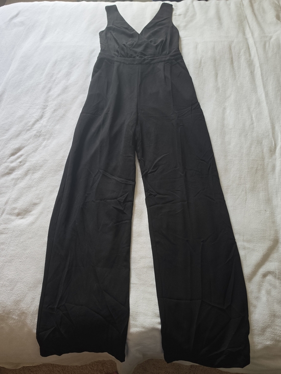 Lulus Pants - Lulu's Black Sleeveless V-Neck Wide-Leg Jumpsuit Back Lace Detail